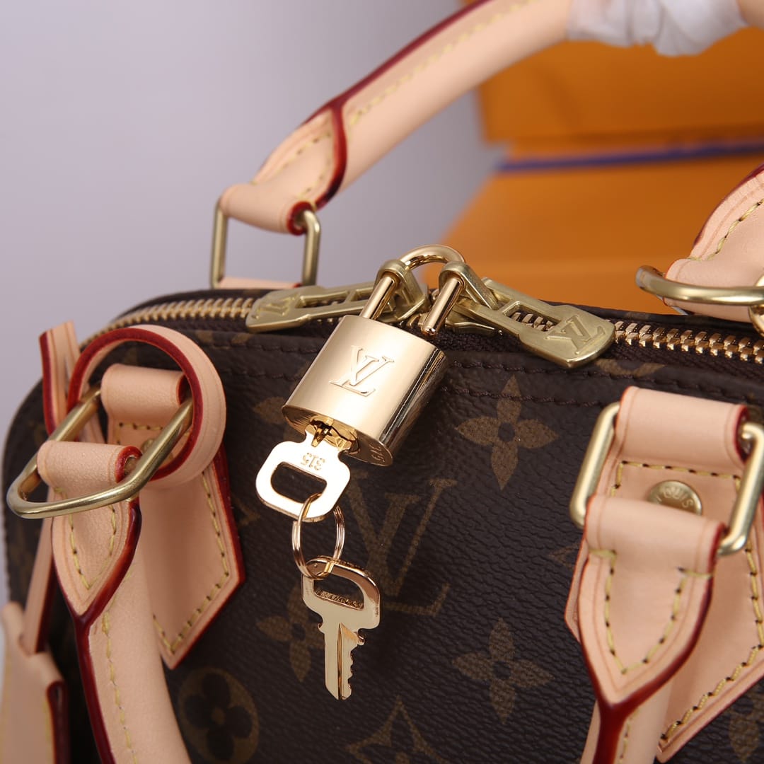 Louis Vuitton Alma BB Handbag in Monogram Coated Canvas