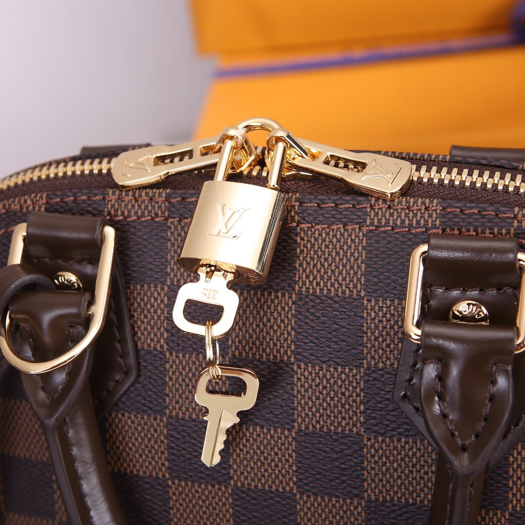 Louis Vuitton Alma BB Handbag in Damier Ebene Coated Canvas