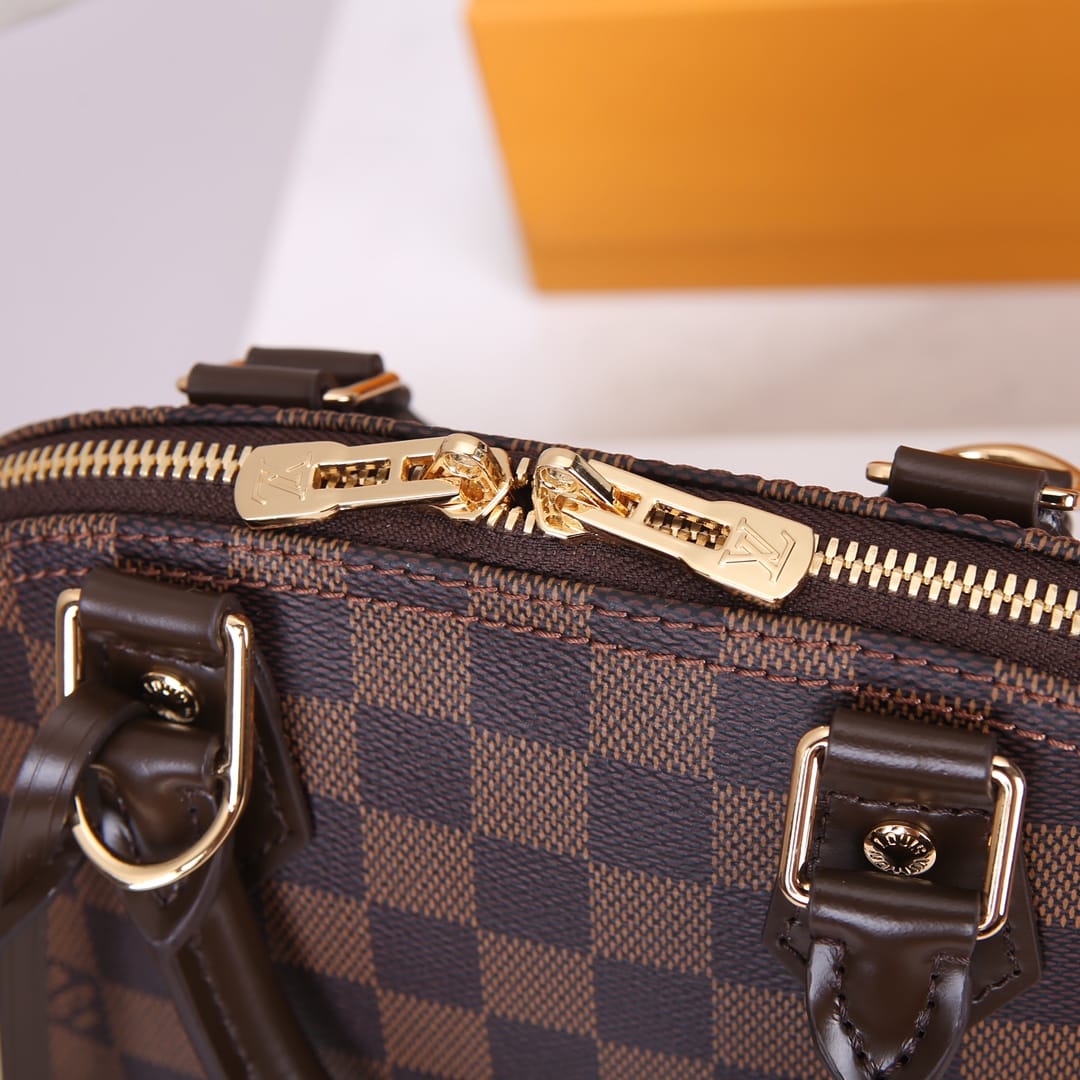 Louis Vuitton Alma BB Handbag in Damier Ebene Coated Canvas