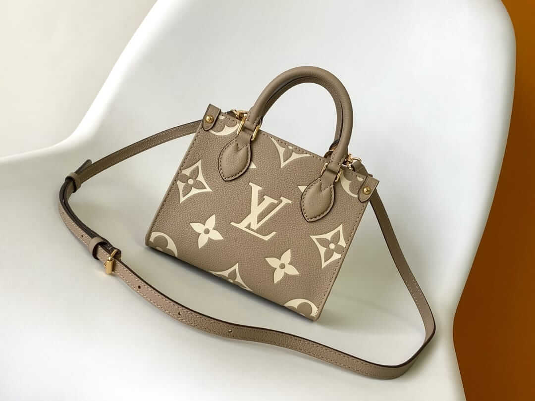 Louis Vuitton OnTheGo BB Toto Bag in Bicolor Monogram Empreinte Leather - Gray/Cream