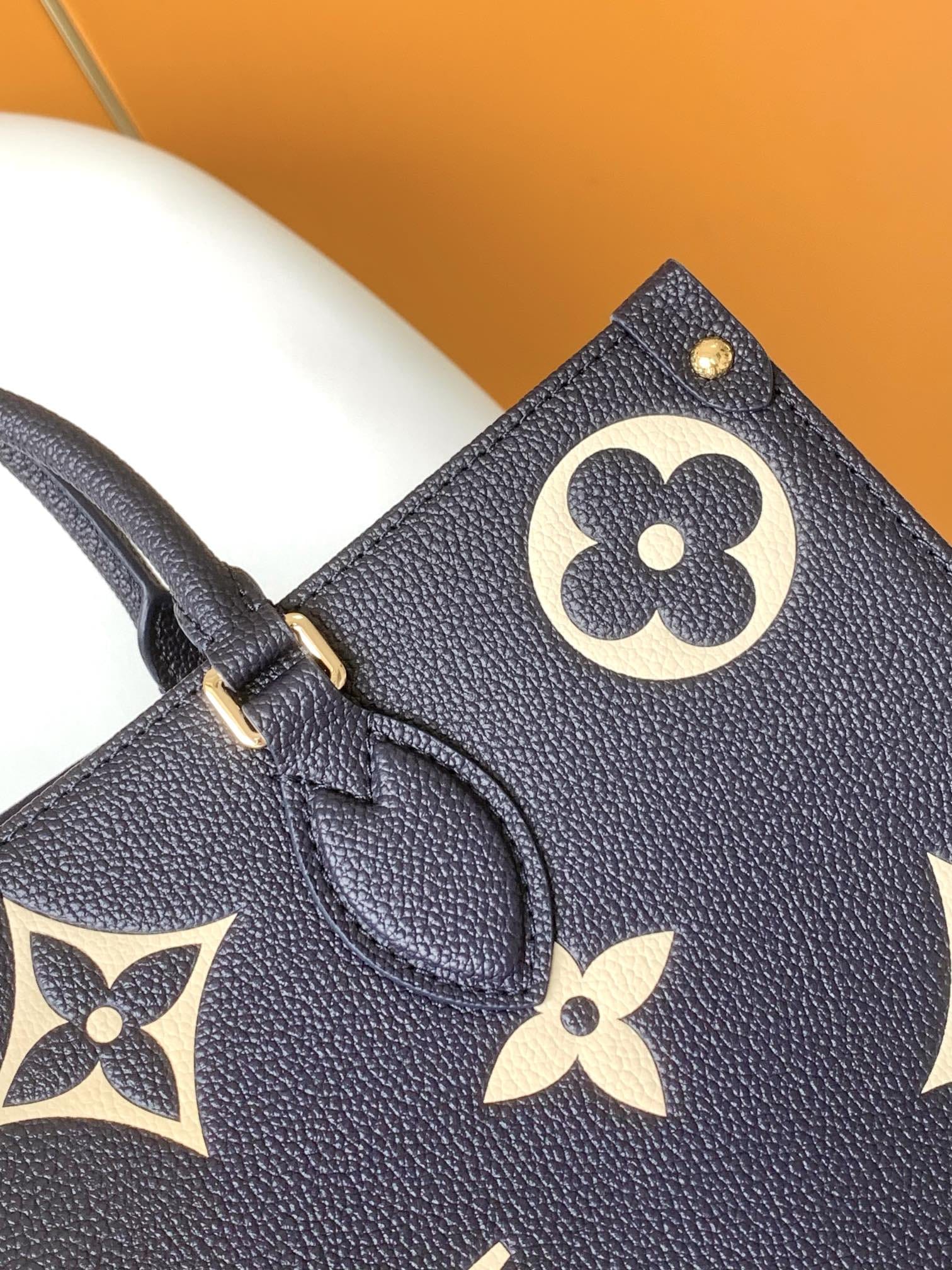 Louis Vuitton OnTheGo MM Toto Bag in Bicolor Monogram Empreinte Leather - Navy Blue/Cream