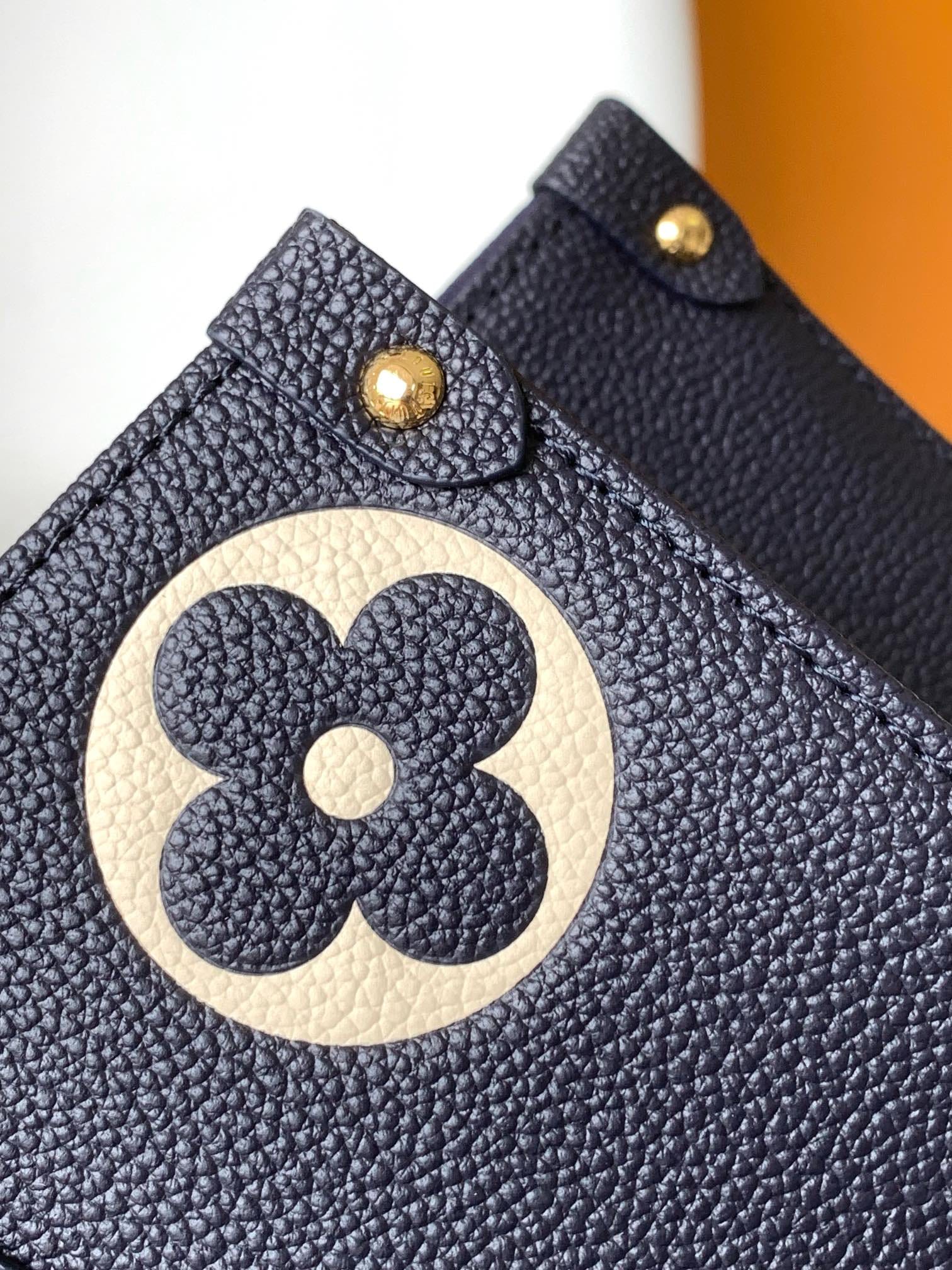 Louis Vuitton OnTheGo MM Toto Bag in Bicolor Monogram Empreinte Leather - Navy Blue/Cream