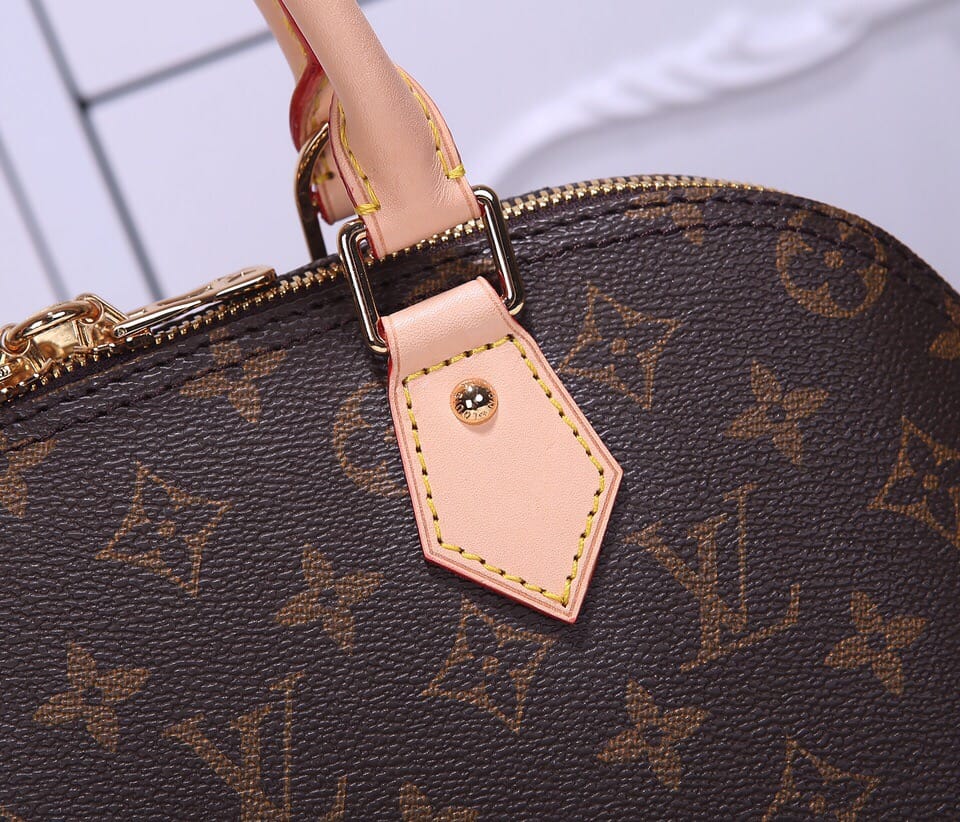 Louis Vuitton Alma PM Handbag in Monogram Coated Canvas