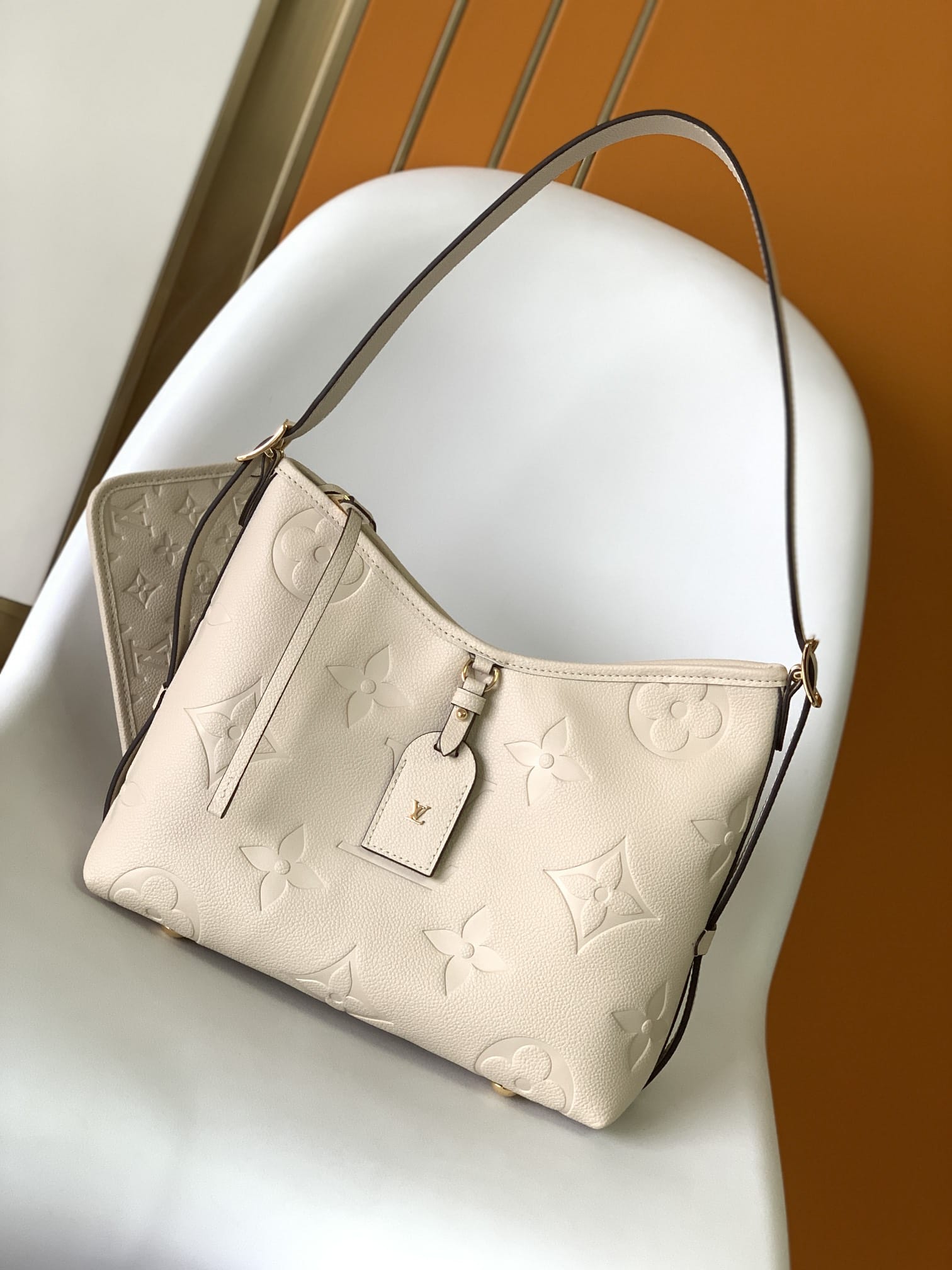 Louis Vuitton CarryAll PM Shoulder Bag in Monogram Empreinte Leather - Cream