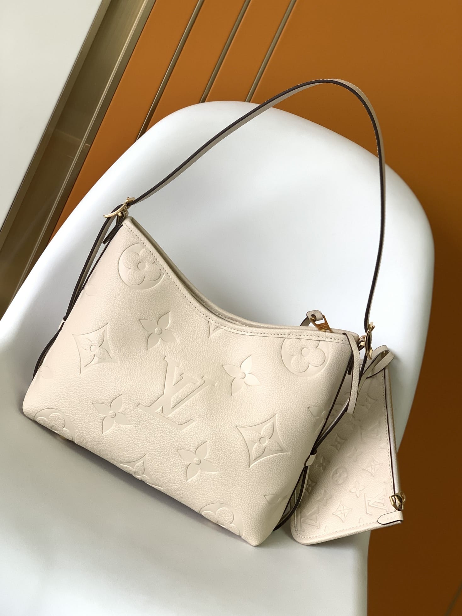 Louis Vuitton CarryAll PM Shoulder Bag in Monogram Empreinte Leather - Cream