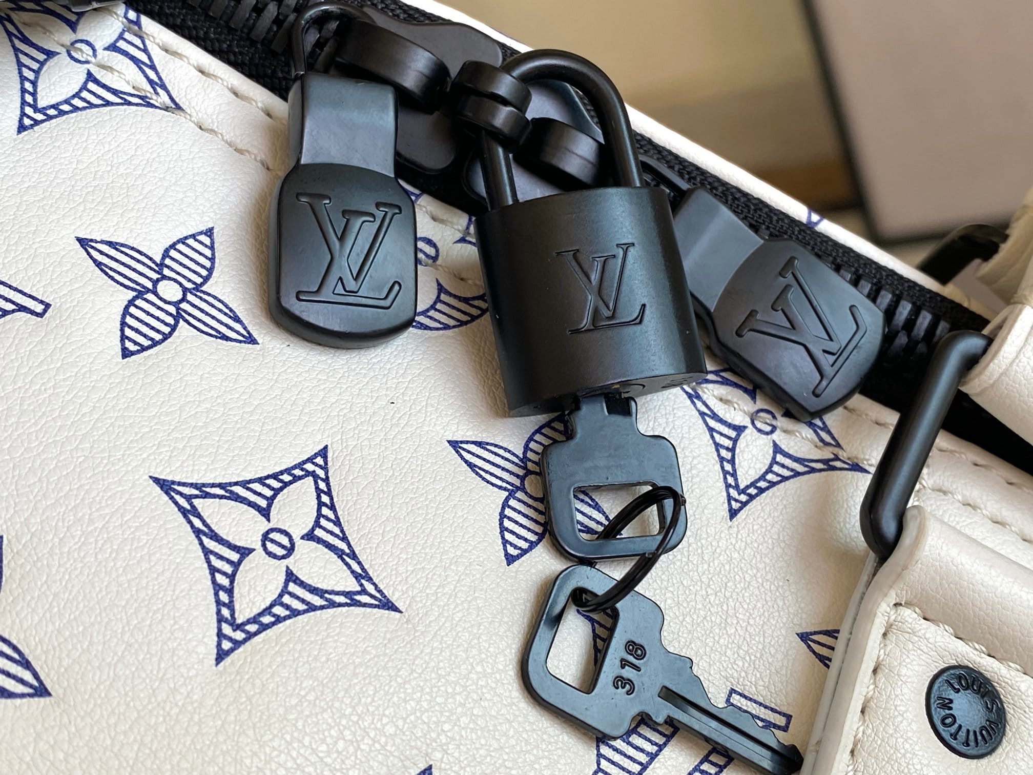 Louis Vuitton Keepall Bandoulière 50 Bag in Monogram Shadow Leather - White/Navy Blue